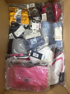 The photo shows a package with clothing in the category ABW.
