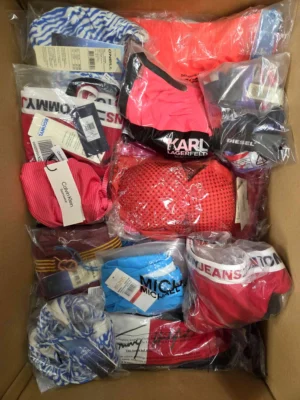 The photo shows a package with clothing in the category ABW.