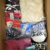 The photo shows a package with clothing in the category ABW.