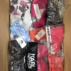 The photo shows a package with clothing in the category ABW.