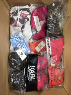 The photo shows a package with clothing in the category ABW.