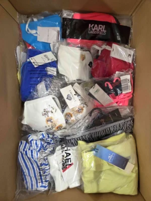 The photo shows a package with clothing in the category ABW.