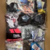 The photo shows a package with clothing in the category ABW.