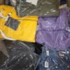 The photo shows a package with clothing in the category AJS.