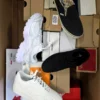 The photo shows a package with footwear in the category BS.