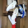 The photo shows a package with footwear in the category BS.