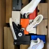 The photo shows a package with footwear in the category BS.