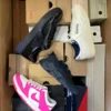 The photo shows a package with footwear in the category BS.