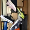 The photo shows a package with footwear in the category BS.