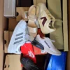 The photo shows a package with footwear in the category BS.