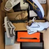 The photo shows a package with footwear in the category BS.