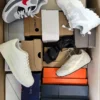 The photo shows a package with footwear in the category BS.