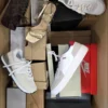 The photo shows a package with footwear in the category BS.
