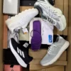 The photo shows a package with footwear in the category BS.