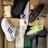 The photo shows a package with footwear in the category BS.