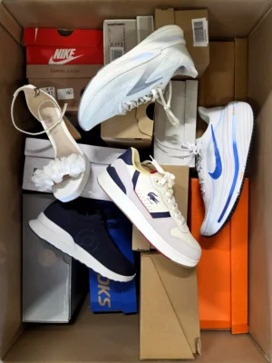 The photo shows a package with footwear in the category BS.