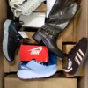 The photo shows a package with footwear in the category BS.