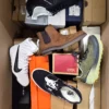 The photo shows a package with footwear in the category BS.