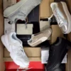 The photo shows a package with footwear in the category BS.