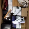 The photo shows a package with footwear in the category BS.