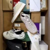 The photo shows a package with footwear in the category BS.