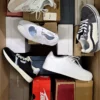 The photo shows a package with footwear in the category BS.
