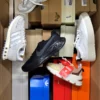 The photo shows a package with footwear in the category BS.