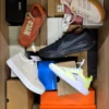 The photo shows a package with footwear in the category BS.