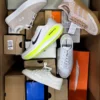 The photo shows a package with footwear in the category BS.