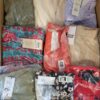 The photo shows a package with clothing in the category AR.
