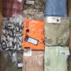 The photo shows a package with clothing in the category AR.