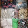 The photo shows a package with clothing in the category AR.