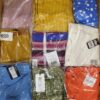 The photo shows a package with clothing in the category AR.