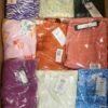 The photo shows a package with clothing in the category AR.