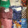 The photo shows a package with clothing in the category AR.