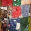 The photo shows a package with clothing in the category AR.