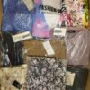 The photo shows a package with clothing in the category AR.