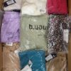 The photo shows a package with clothing in the category AR.