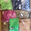 The photo shows a package with clothing in the category AR.