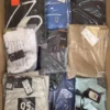 The photo shows a package with clothing in the category AM.