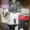 The photo shows a package with clothing in the category AM.