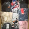 The photo shows a package with clothing in the category AM.