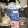 The photo shows a package with clothing in the category AM.