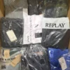 The photo shows a package with clothing in the category AM.