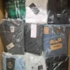 The photo shows a package with clothing in the category AM.