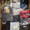 The photo shows a package with clothing in the category AM.