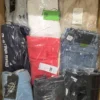 The photo shows a package with clothing in the category AM.