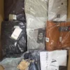 The photo shows a package with clothing in the category AM.