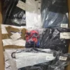 The photo shows a package with clothing in the category AM.