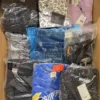 The photo shows a package with clothing in the category AM.